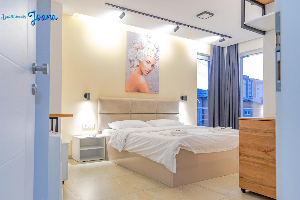 A calm, tastefully decorated bedroom at Apartments Joana